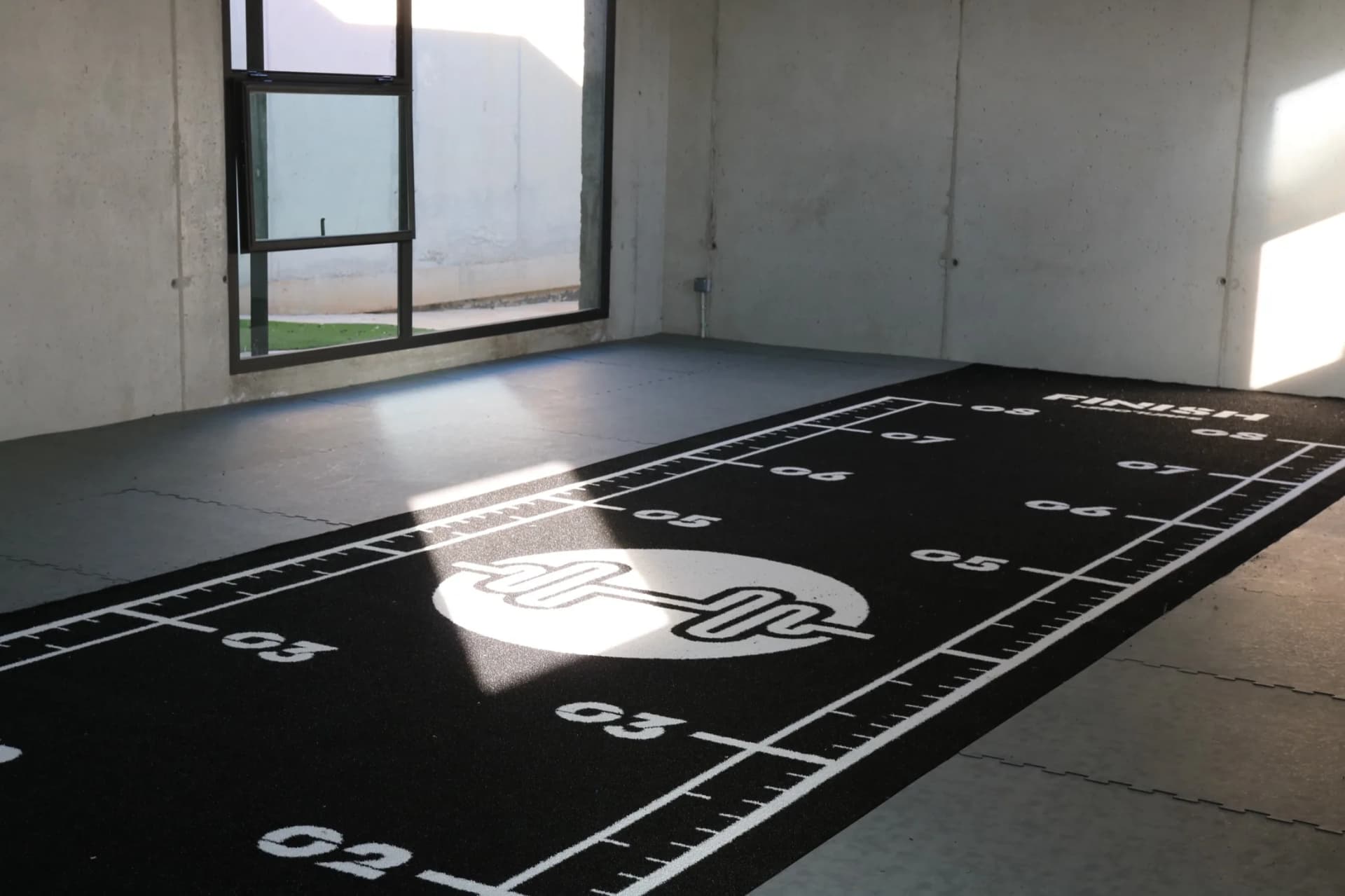 Heroturfs sports turf track delivered and laid out in a gym